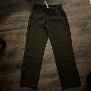 Dark green lululemon track pants.
